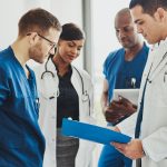 Group of doctors reading a document